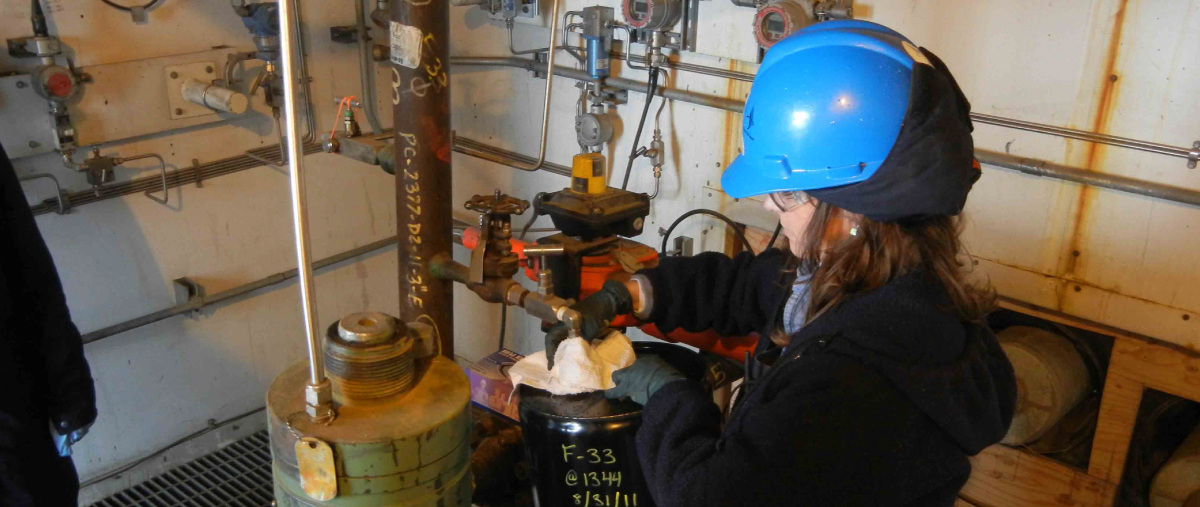 Student filling tanks