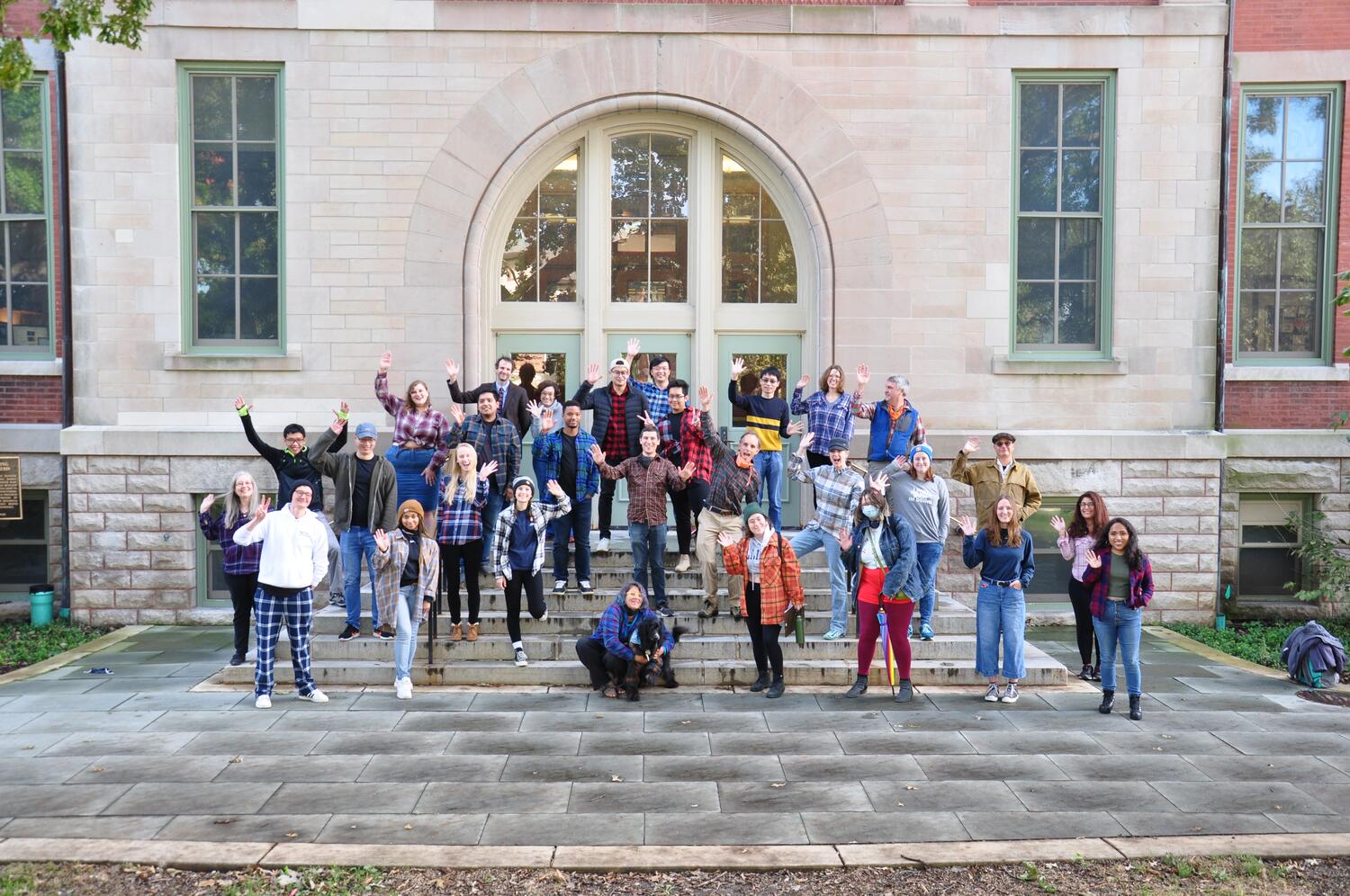 Faculty and students waving during Flannel Friday